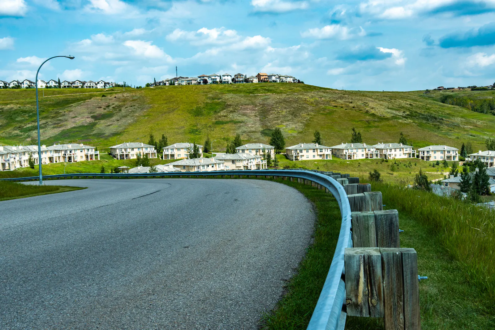Grassy hills rising above the Bow Valley at Cochrane