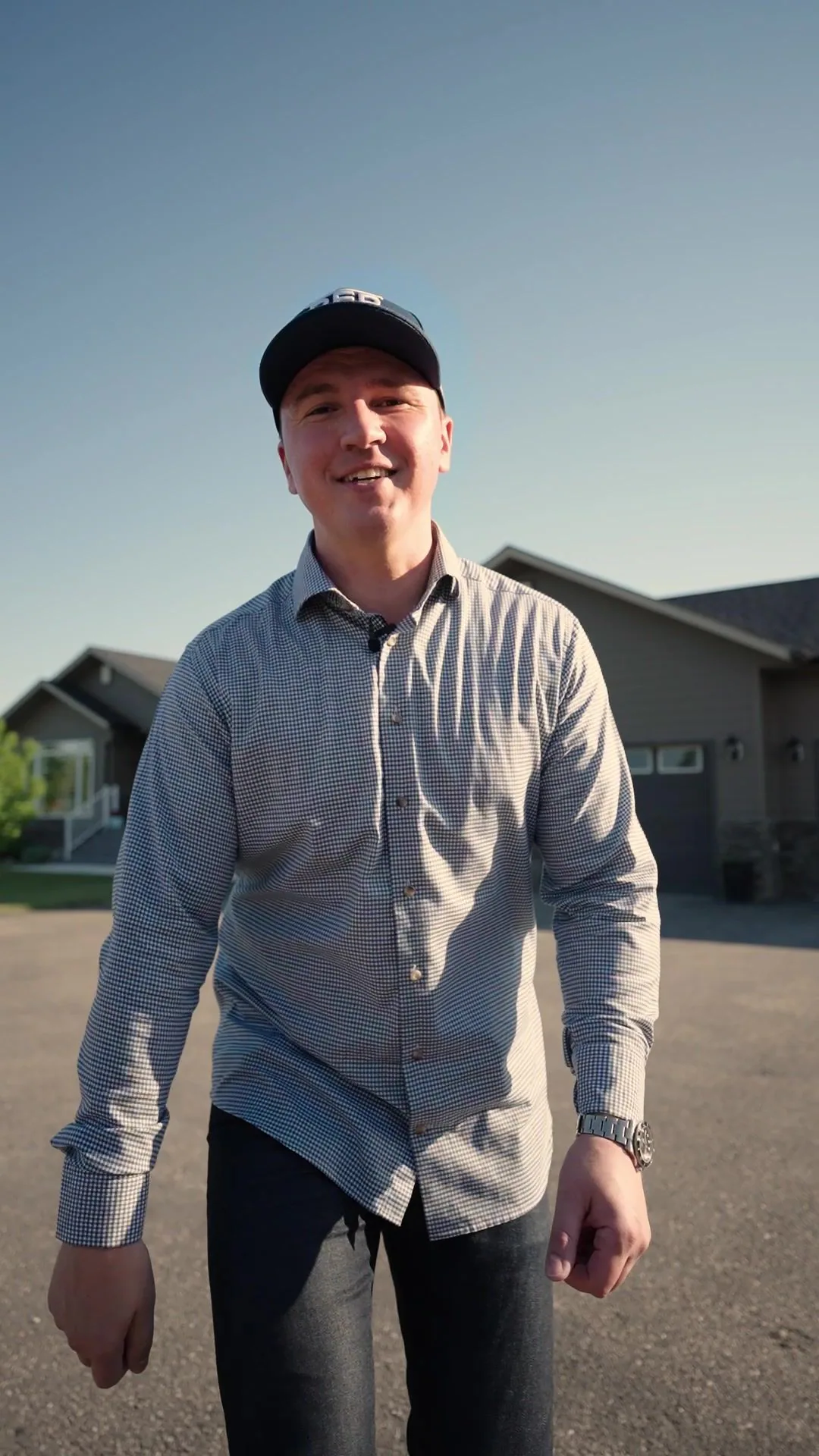Dusko Sremac walking up the driveway of an acreage listing on a summer evening
