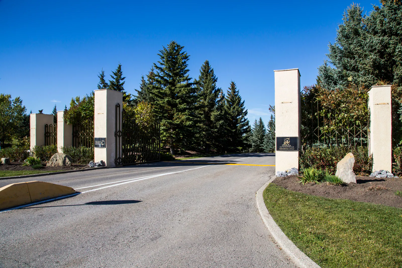 Stone gateposts at the entrance to an Elbow Valley estate community