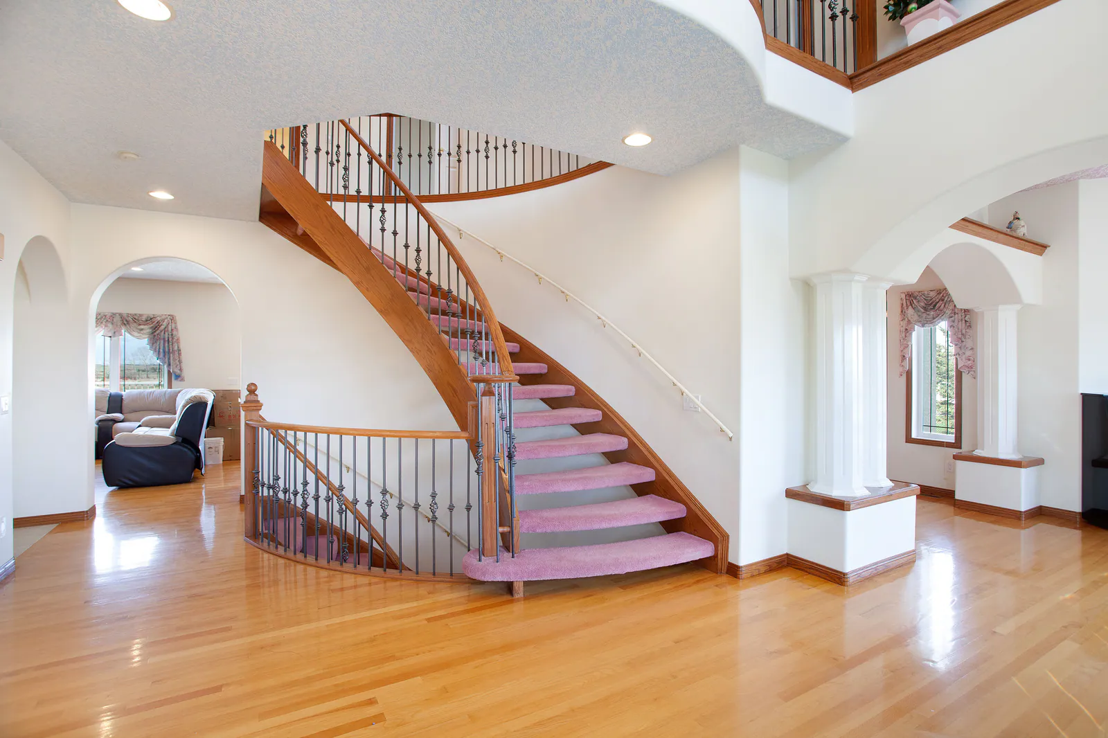 Foyer with curved staircase