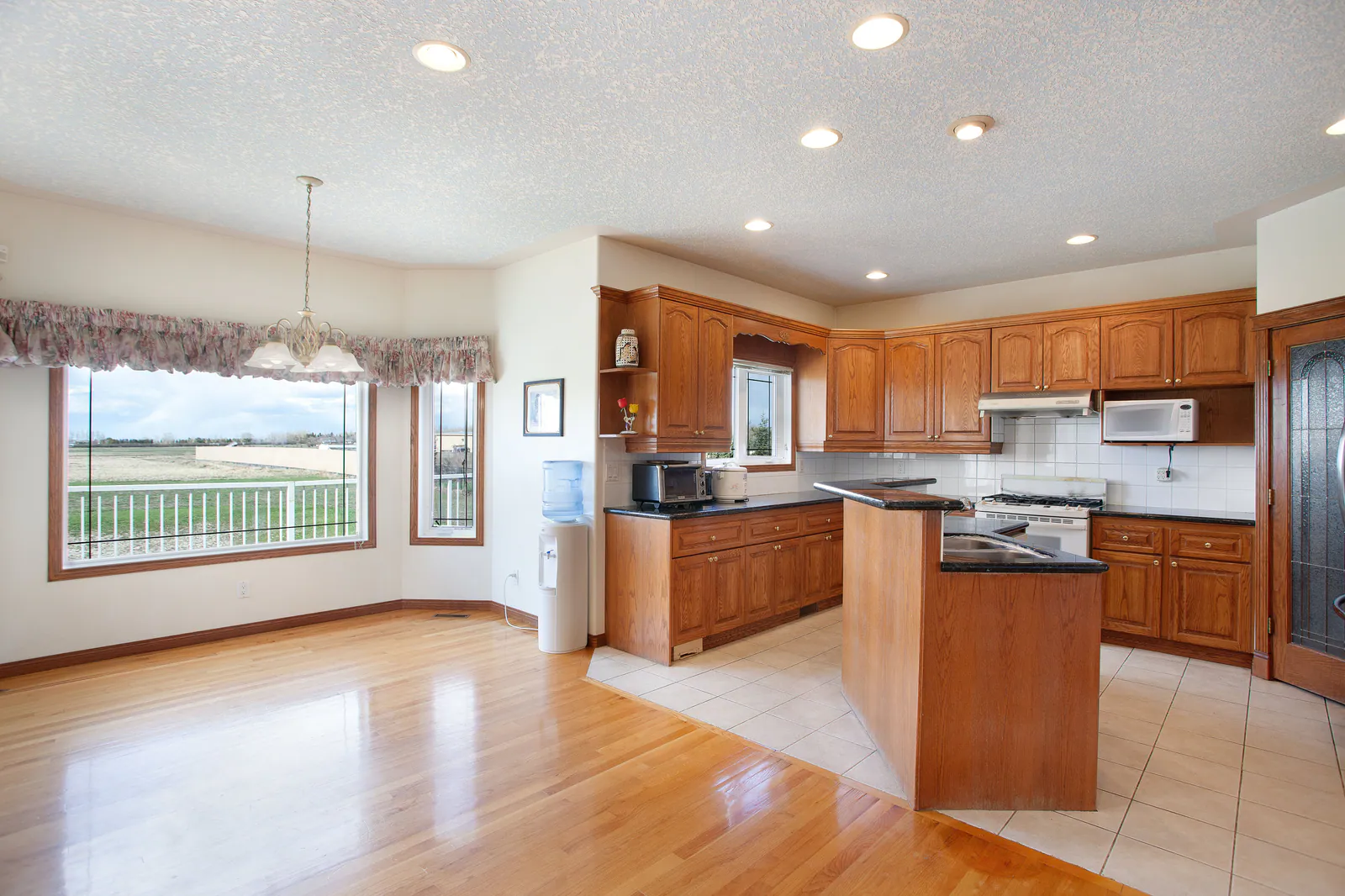 Kitchen and nook with windows to the land