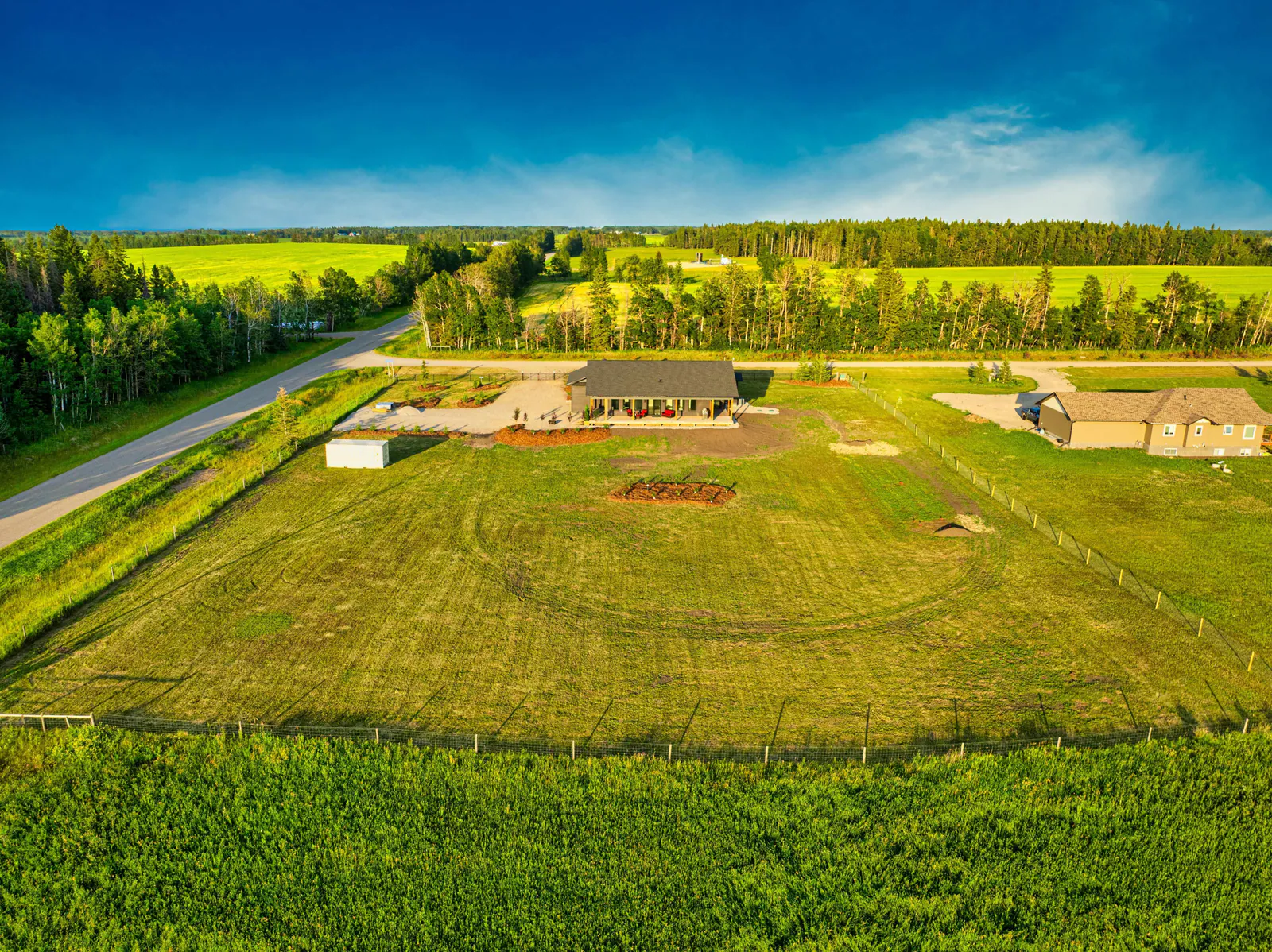 Wide aerial of the home within Eagle Hill acreage country