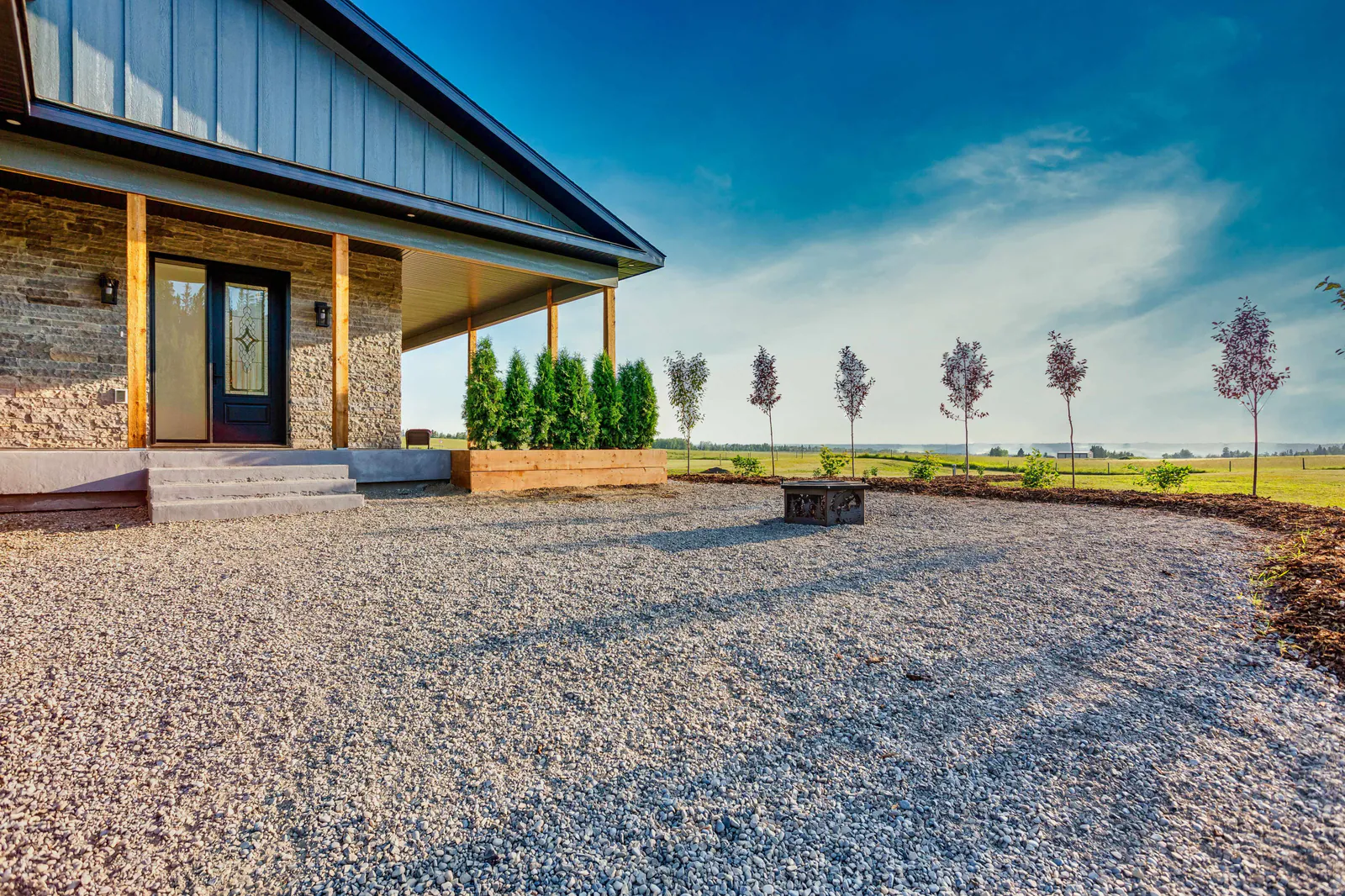 Front porch entry with timber posts and stone
