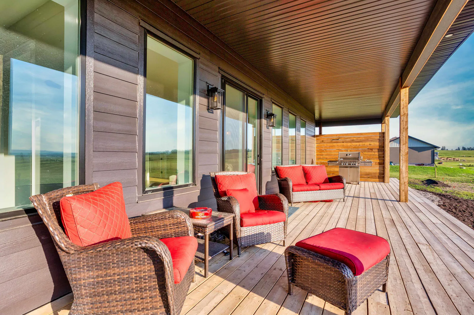 Covered wraparound deck looking over open land