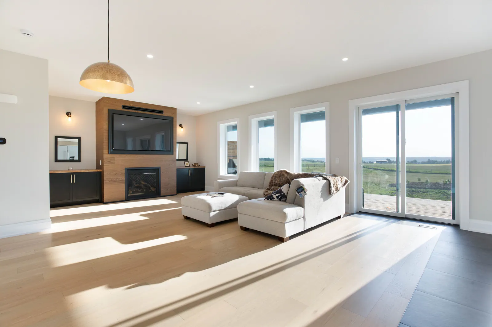 Living room with gas fireplace and triple-pane windows