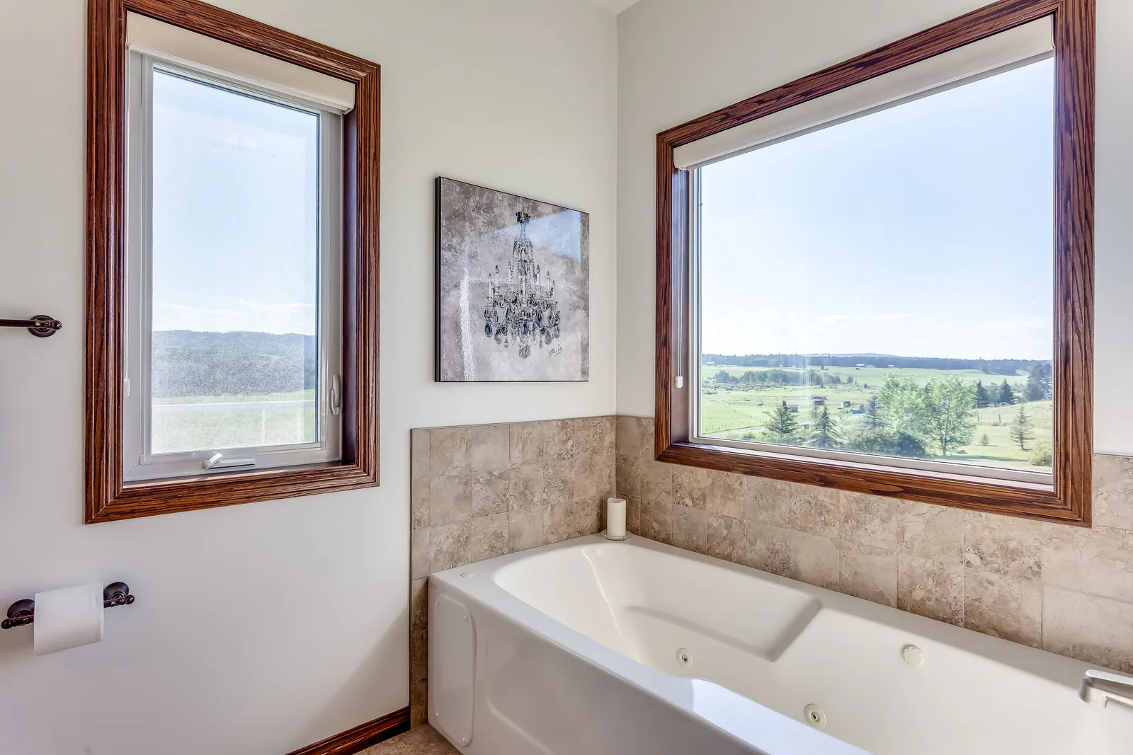 Ensuite soaker tub beneath a view window
