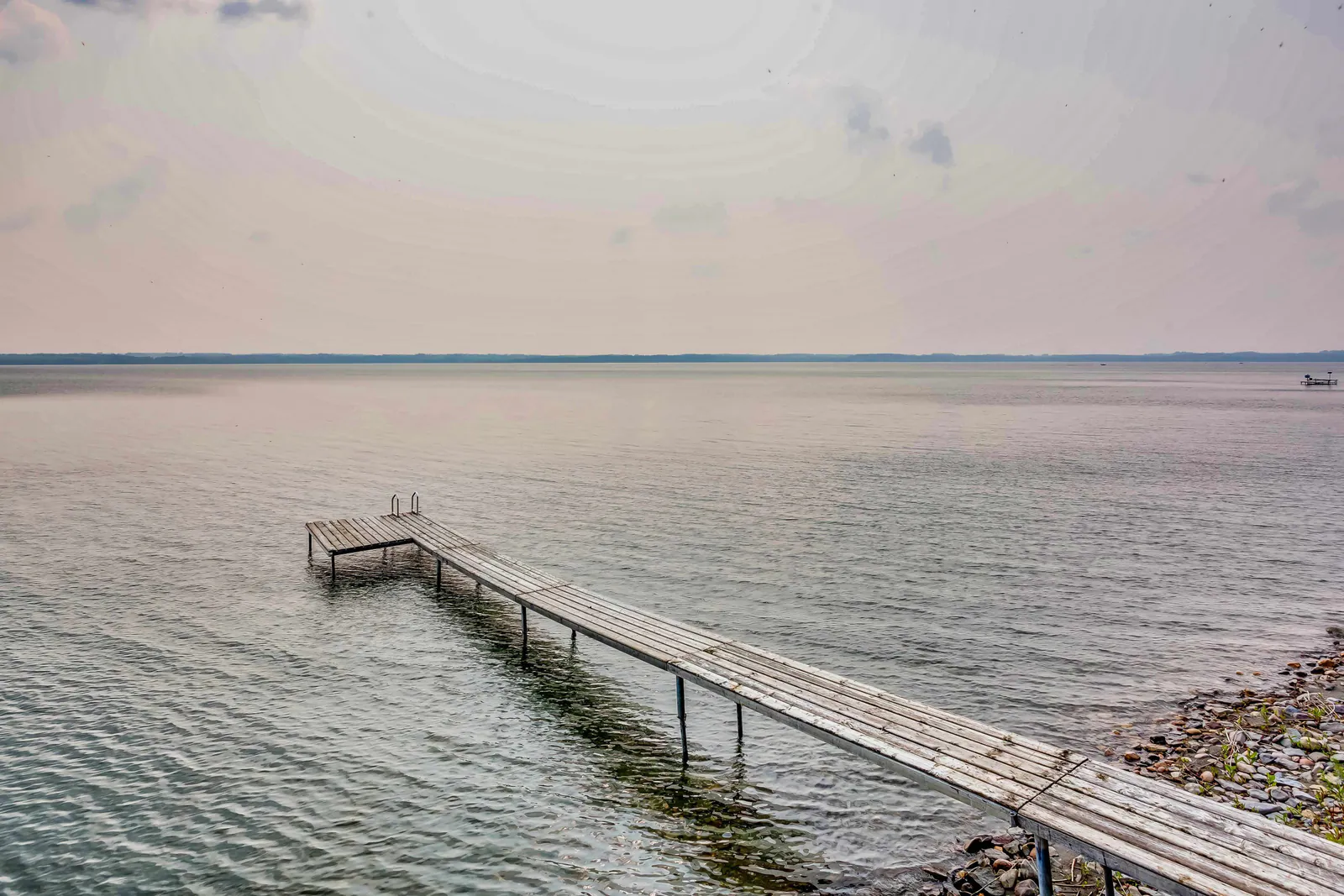 Private dock extending into Sylvan Lake