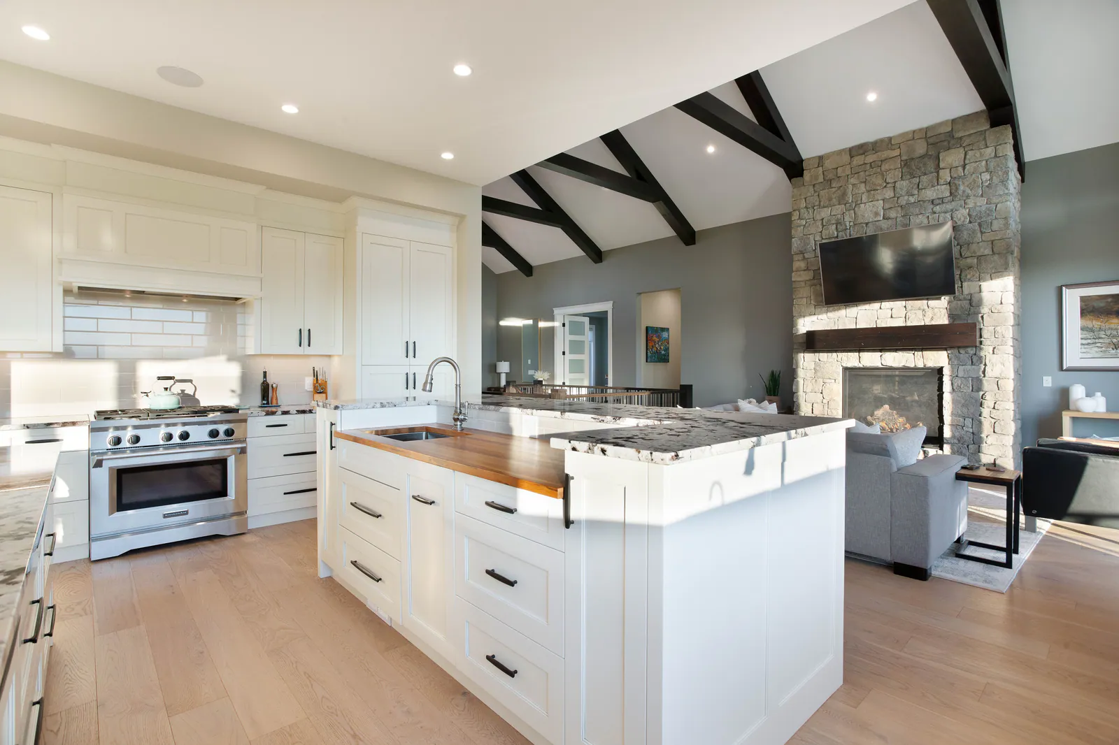 Chef's kitchen with two islands and a professional range